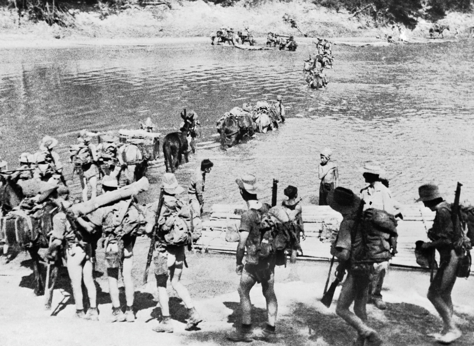 A Chindit column crossing a river in Burma. 